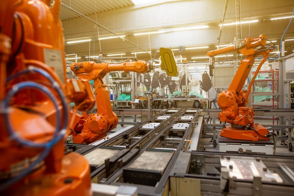 Machines working in an aI automated factory, replacing human labor.
