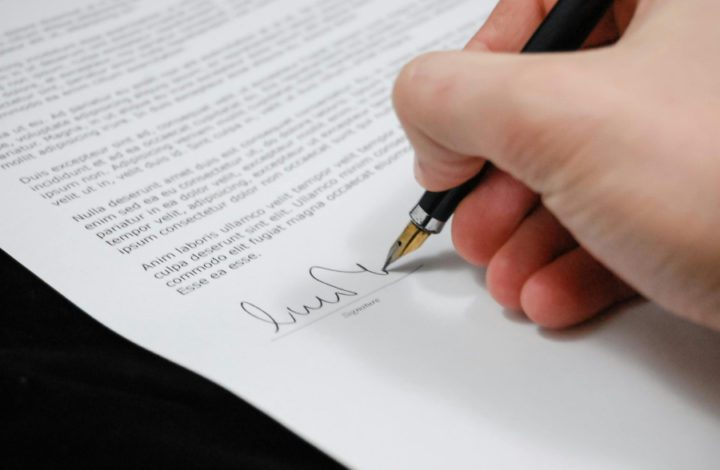 Man signing document