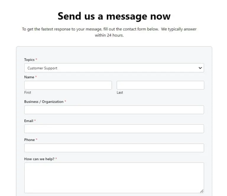 Online contact form titled 'Send us a message now' for sending a message to support, with fields for Topic, First/Last name, Business/Organization, Email, Phone, and a large message box.