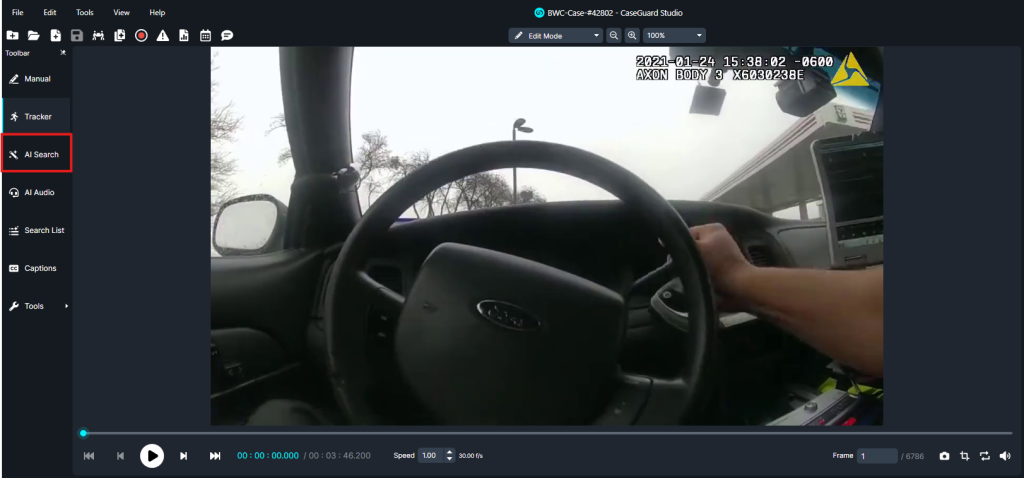 ai-search-new | CaseGuard Front-seat view from a car dashboard camera showing a driver’s hand on the steering wheel and the windshield ahead; police body‑cam overlay and equipment visible on the dashboard.
